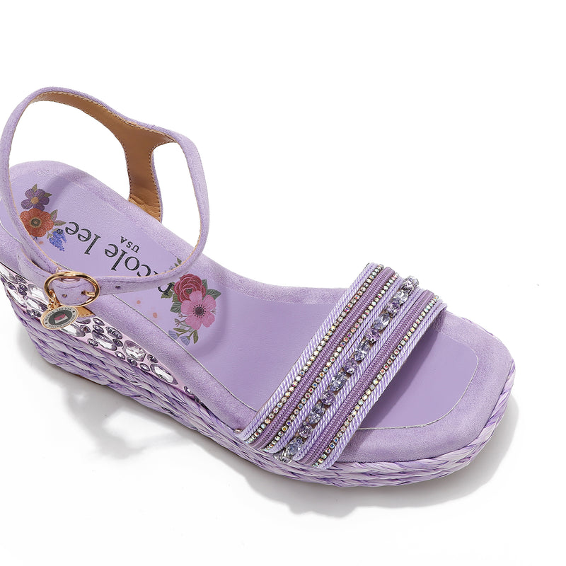 Kali Espadrille Wedge sandal in purple.  Fitted with 1 adjustable buckle. .The insole is purple with the Nicole Lee logo. Top strap is embellished with rhinestones.