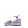 Kali Espadrille Wedge sandal in Purple.  Fitted with 1 adjustable buckle. The buckle has a small Nicole Lee Charm. The wedge is adorned with rhinestones and  braid detailing.