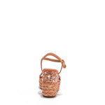 The platform wedge is adorned with pink rhinestones and  braid detailing.