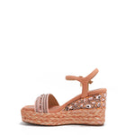 Kali Espadrille Wedge sandal in pink.  Fitted with 1 adjustable buckle. The buckle has a small Nicole Lee Charm.The wedge is adorned with rhinestones and  braid detailing.