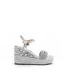 Kali Espadrille Wedge sandal in Silver.  Fitted with 1 adjustable buckle. The buckle has a small Nicole Lee Charm.The wedge is adorned with rhinestones and  braid detailing.