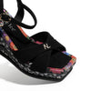 BONNIE ESPADRILLE WEDGE SANDAL THE CRISSCROSS STRAPS WITH THE NL INITIALS IN THE MIDDLE. THE BLACK INSOLE WITH FLORAL PRINT ON THE EDGES.