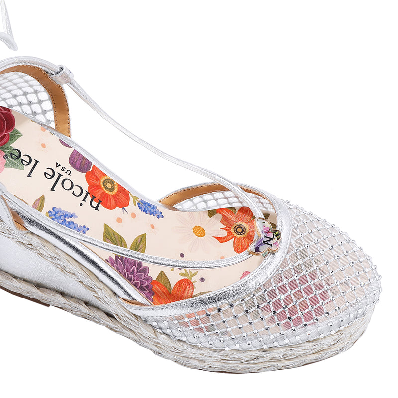 MAYA WRAP ESPADRILLE WEDGE SANDAL FRONT VIEW. REFINED RHINESTONE MESH CLOSED TOE CAP WITH A FLORAL PRINT INSOLE.