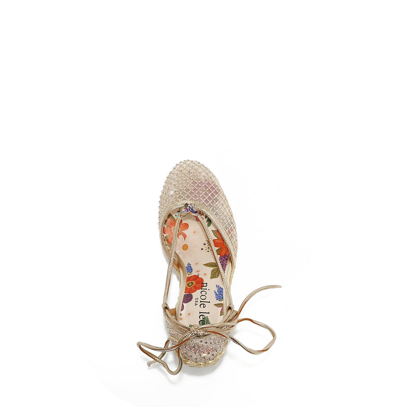 MAYA WRAP ESPADRILLE WEDGE SANDAL FROM A VIEW FROM ABOVE. FEATURES RHINESTONE MESH TOE CAP. TWO STRAPS THAT ARE TIED IN A BOW SHAPE.  THE INSOLE HAS A FLORAL PRINT.