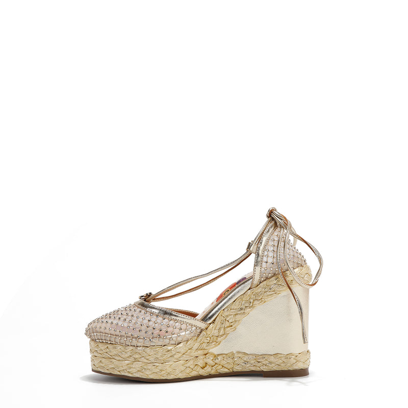 MAYA WRAP ESPADRILLE WEDGE SANDAL IN COLOR GOLD. RHINESTONE MESH TOE CAP AND A BRAIDED TRIM PLATFORM. IT HAS TWO STRAPS WHERE YOU CAN TIE IT ON THE BACK OF THE ANKLE.