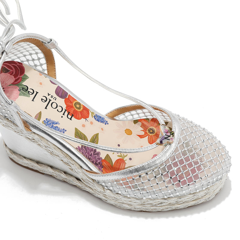 MAYA WRAP ESPADRILLE WEDGE SANDAL FRONT VIEW. REFINED RHINESTONE MESH CLOSED TOE CAP WITH A FLORAL PRINT INSOLE.