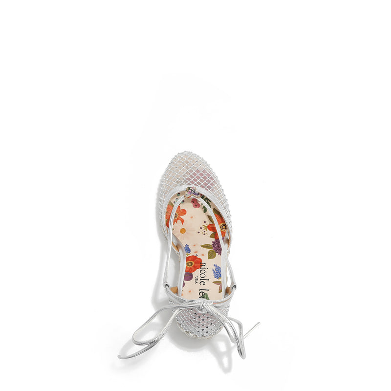 MAYA WRAP ESPADRILLE WEDGE SANDAL FROM A VIEW FROM ABOVE. FEATURES RHINESTONE MESH TOE CAP. TWO STRAPS THAT ARE TIED IN A BOW SHAPE.  THE INSOLE HAS A FLORAL PRINT.
