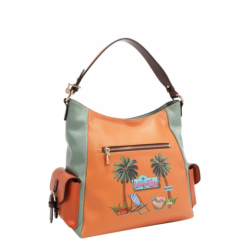 Our Sun and sand Hobo bag with a tropical design featuring palm trees, chair and 2 side pockets.