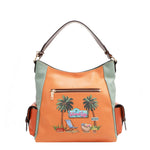 Our Sun and sand Hobo bag with a tropical design featuring palm trees and chair.