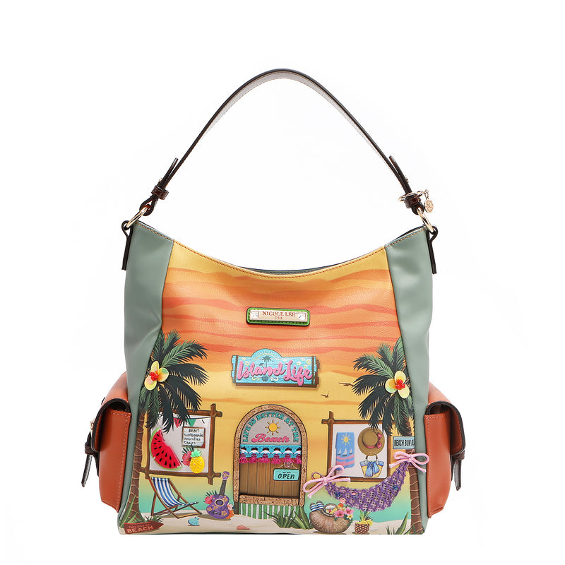 Our Sun and sand Hobo bag with a tropical design featuring palm trees and a beach hut.