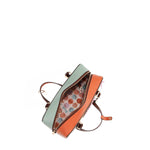Our Sun and Sand Shoulder handbag Open with shells interior lining set on a white background
