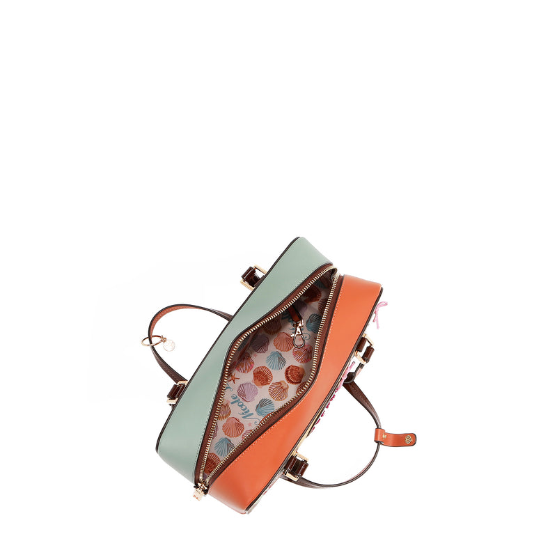 Our Sun and Sand Shoulder handbag Open with shells interior lining set on a white background